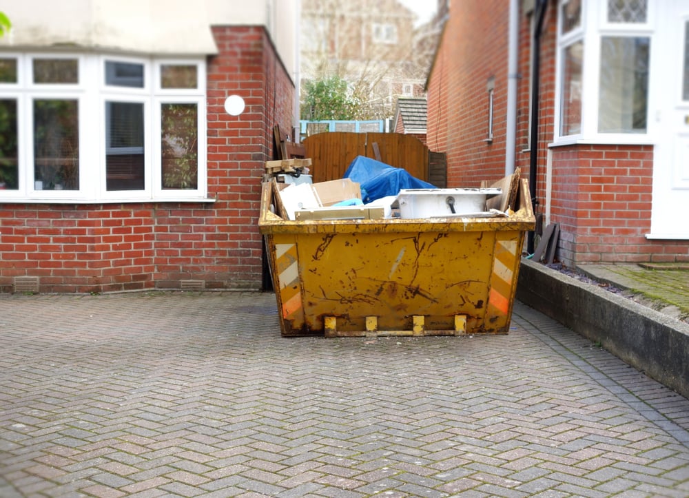 Skip on a british driveway